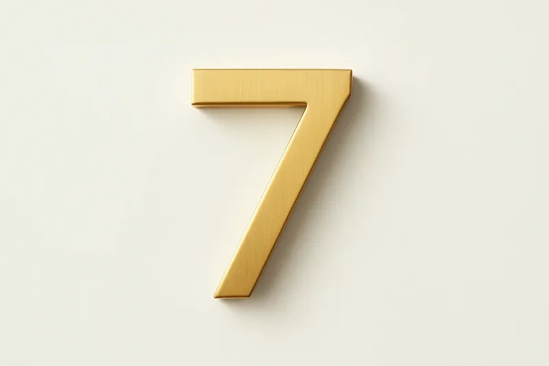 Single large golden seven symbol on cream background with soft shadow